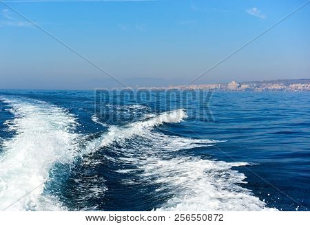 Wavy Trail On The Mediterranean Sea After Vessel, Ship, Ferry Speed Floating. Tourist Ferry In The S