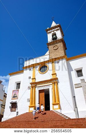 Ayamonte, Spain - June 11, 2017 - Three People Walking Up The Steps To The Las Angustias Parish Chur