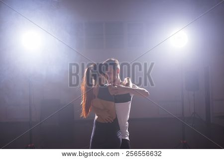 Young Couple Dancing Social Danse Kizomba Or Bachata Or Semba Or Taraxia In Dancing Class Background