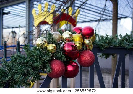 Christmas Decorations - Big Shiny Red And Yellow Balls In Public Space.