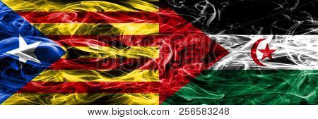Catalonia Vs Sahrawi Copy Smoke Flags Placed Side By Side. Thick Colored Silky Smoke Flags Of Catala