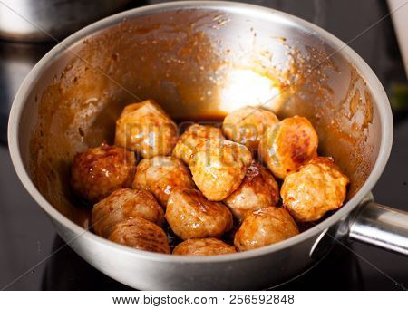 Prepapration Of Chili Chicken Meatballs With Ginger Sauce Served Witn Greens