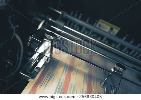 Printing Press With Blurred Belt During Printing Process.