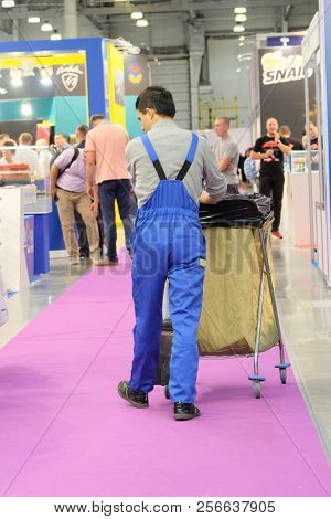 Moscow, Russia - August, 29, 2018: cleaner in the exebition hall in Moscow, Russia