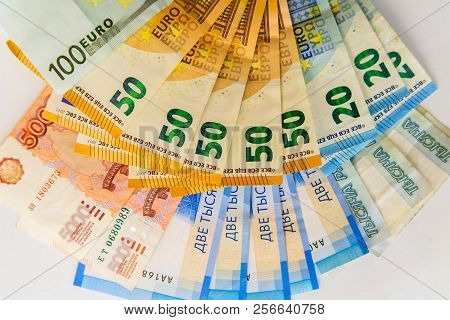 Russian Rubles And Euro Banknotes On White Background