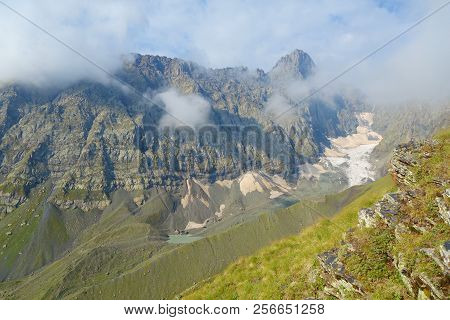Views On A Snowy Chaukhi Mountain Pass On A Hiking Trail From Abudelauri Lakes To Juta In Caucasus M