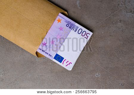 Euro In Beige Envelope, Isolated On A Grey Background