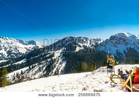 View On Snowy Mountain Landscape In The Bavarian Alps And Toboggan - Germany