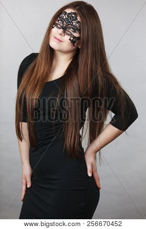 Pretty Mysterious Woman Wearing Black Eye Lace Mask Having Long Brown Hair.