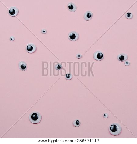 Abstract Pattern Many Plastic Toy Eyes On The Pink Pstel Background Flat Lay Creative Surreal