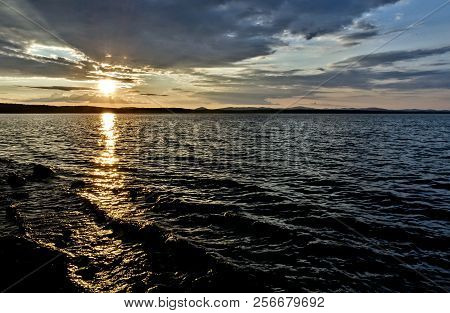 Golden Sun Sinks Over The Lake In The Evening, Golden Water, South Ural Lake Uvildy