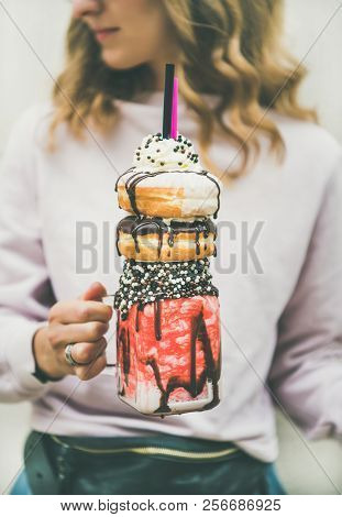 Girl Holding Cold Strawberry Donut Freakshake In Mason Jar