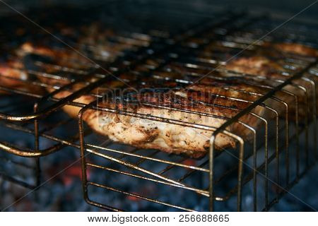 Grilled Chicken Tabaka On The Flaming Grill