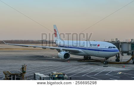Passenger Airplane Docking At The Airport