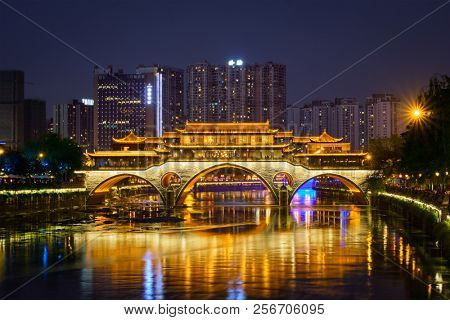 Famous landmark of Chengdu - Anshun bridge over Jin River illuminated at night, Chengdue, Sichuan , China