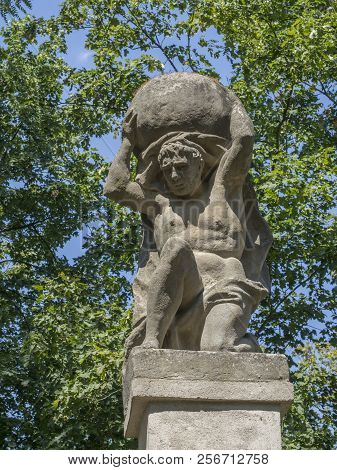 Stone Men Figure Carrying Stone, Baroque Statue From Greek Mythology Of Sisyphus Or Sisyphos