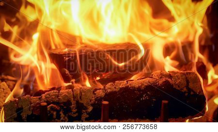 Closeup Image Of Firepalce At House With Burning Logs
