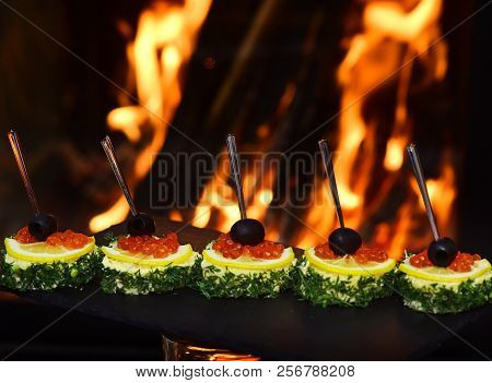 Assorted Canape With Caviar Buffet Food. Red Caviar Appetizers With Lemon And Dill. The Best Or Noth