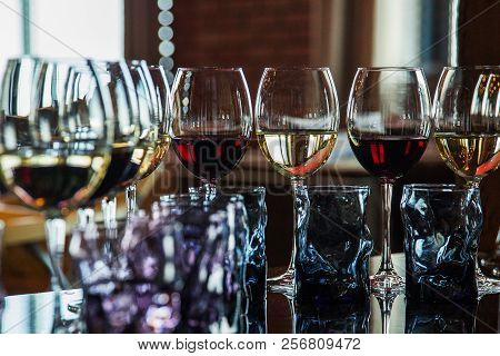 Glasses With Alcoholic Drinks In A Restaurant