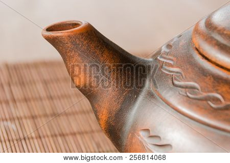 A Beautiful Clay Teapot With An Orienic Pattern. Tea Drinking.