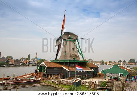 Zaanse Schans, Netherlands, August 19, 2015 - Traditional, Authentic Dutch Windmills At The River Za