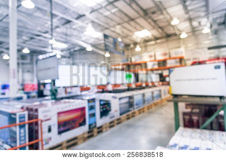 Blurry Background Big Screen Tvs On Shelf At Wholesale Store In America