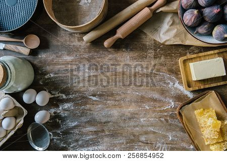 Top View Of Messy Wooden Table With Spilled Flour And Baking Ingredients