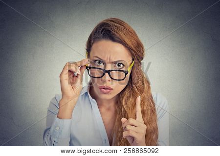 Business Woman Wagging Her Finger Isolated On Gray Wall Background