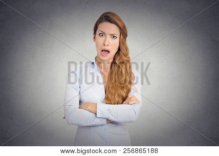 Pissed Of Angry Young Woman With Disgusted Face Expression Shouting On Grey Wall Background