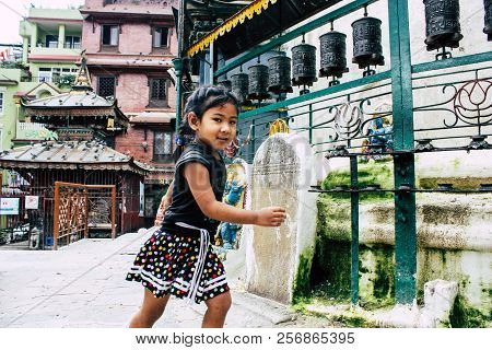 Kathmandu Nepal August 24, 2018 View Of A Nepali Child Playing Around The Shree Gha Stupa Temple Loc