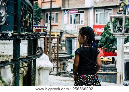 Kathmandu Nepal August 24, 2018 View Of A Nepali Child Playing Around The Shree Gha Stupa Temple Loc