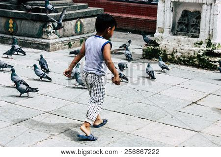 Kathmandu Nepal August 24, 2018 View Of A Nepali Child Playing Around The Shree Gha Stupa Temple Loc