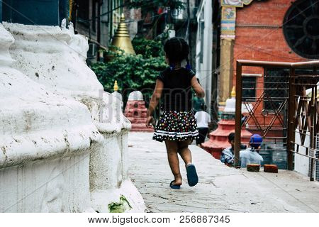 Kathmandu Nepal August 24, 2018 View Of A Nepali Child Playing Around The Shree Gha Stupa Temple Loc