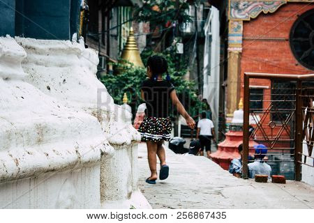 Kathmandu Nepal August 24, 2018 View Of A Nepali Child Playing Around The Shree Gha Stupa Temple Loc