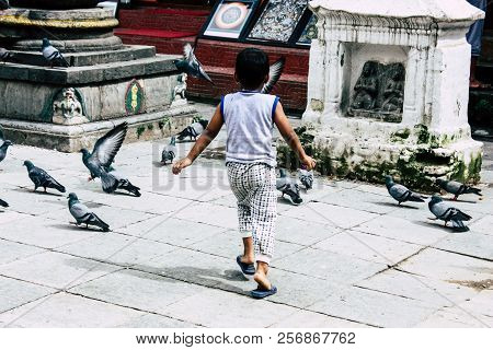 Kathmandu Nepal August 24, 2018 View Of A Nepali Child Playing Around The Shree Gha Stupa Temple Loc