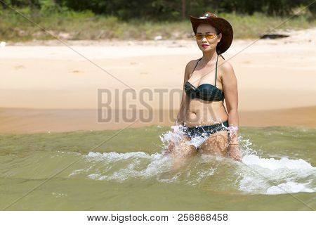 Woman Show Beautiful Enjoy With Bikini Hat And Wave On Beach At Bang Beot Beach, Chumphon Province T