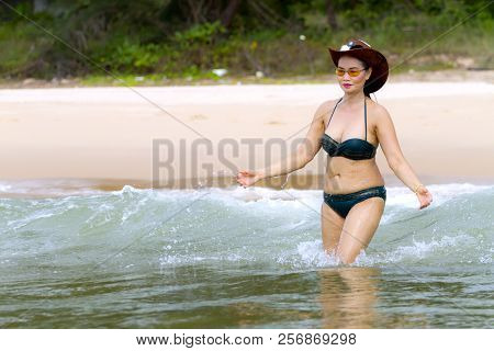 Women Shape Pretty With Bikini Play Wave On Beach At Bang Beot Beach, Chumphon Province Thailand