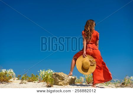 woman sunbathing on the beach summer travel holidays