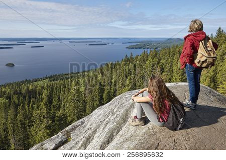 Finnish Landscape At Sunset With Hikers. Lake Pielinien. Koli Viewpoint