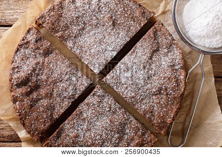 Homemade Swedish Chocolate Sticky Cake Close-up On A Table. Horizontal Top View From Above