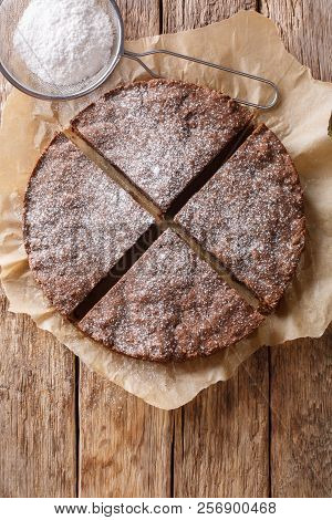 Swedish Traditional Dessert: Kladdkaka Chocolate Sticky Cake With Powdered Sugar Close-up. Vertical