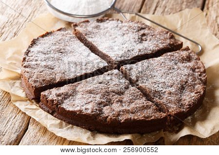Swedish Traditional Dessert: Kladdkaka Chocolate Sticky Cake With Powdered Sugar Close-up. Horizonta