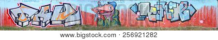 Full And Acomplished Graffiti Artwork. The Old Wall Decorated With Paint Stains In The Style Of Stre