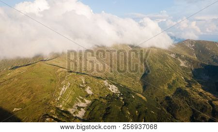 View Of The Mountains Range In Clouds From A Bird's Eye View