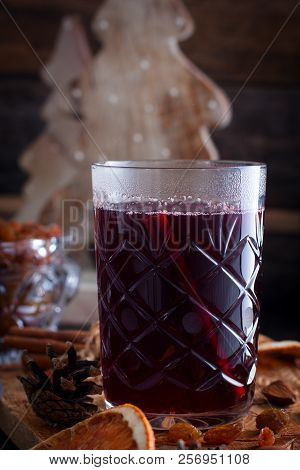 Scandinavian Hot Alcoholic Drink With Cinnamon In A Glass Cup On A Wooden Board, Selective Focus