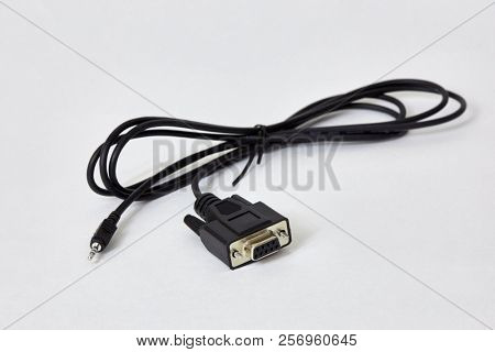 RS-232 mini-jack cable on white background.