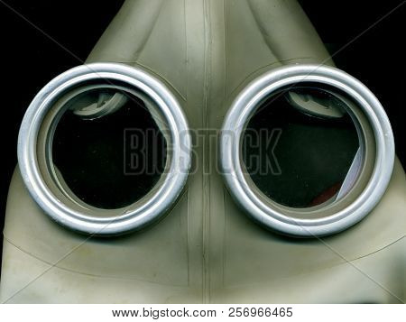 Old Soviet Green Gas Mask. The Eye Of An Old Gas Mask. Postapocalypse.