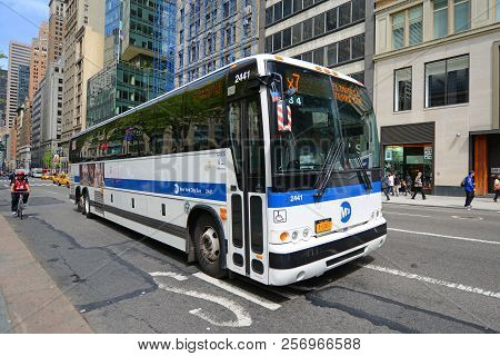 New York City - May 7, 2013: Mta Hybrid Electric Bus Route X7 On Fifth Avenue At 42nd Street, New Yo