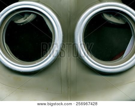 Old Soviet Green Gas Mask. The Eye Of An Old Gas Mask. Postapocalypse.