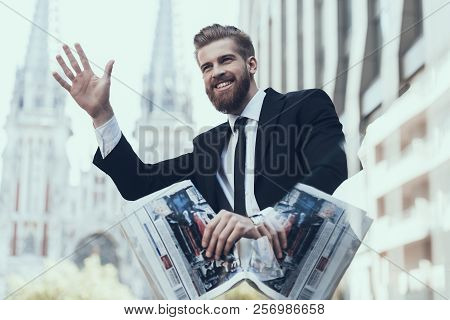Smiling Handsome Businessman Meeting Somebody. Guy Handing Up. Man Waiting Somebody. Bearded Serious